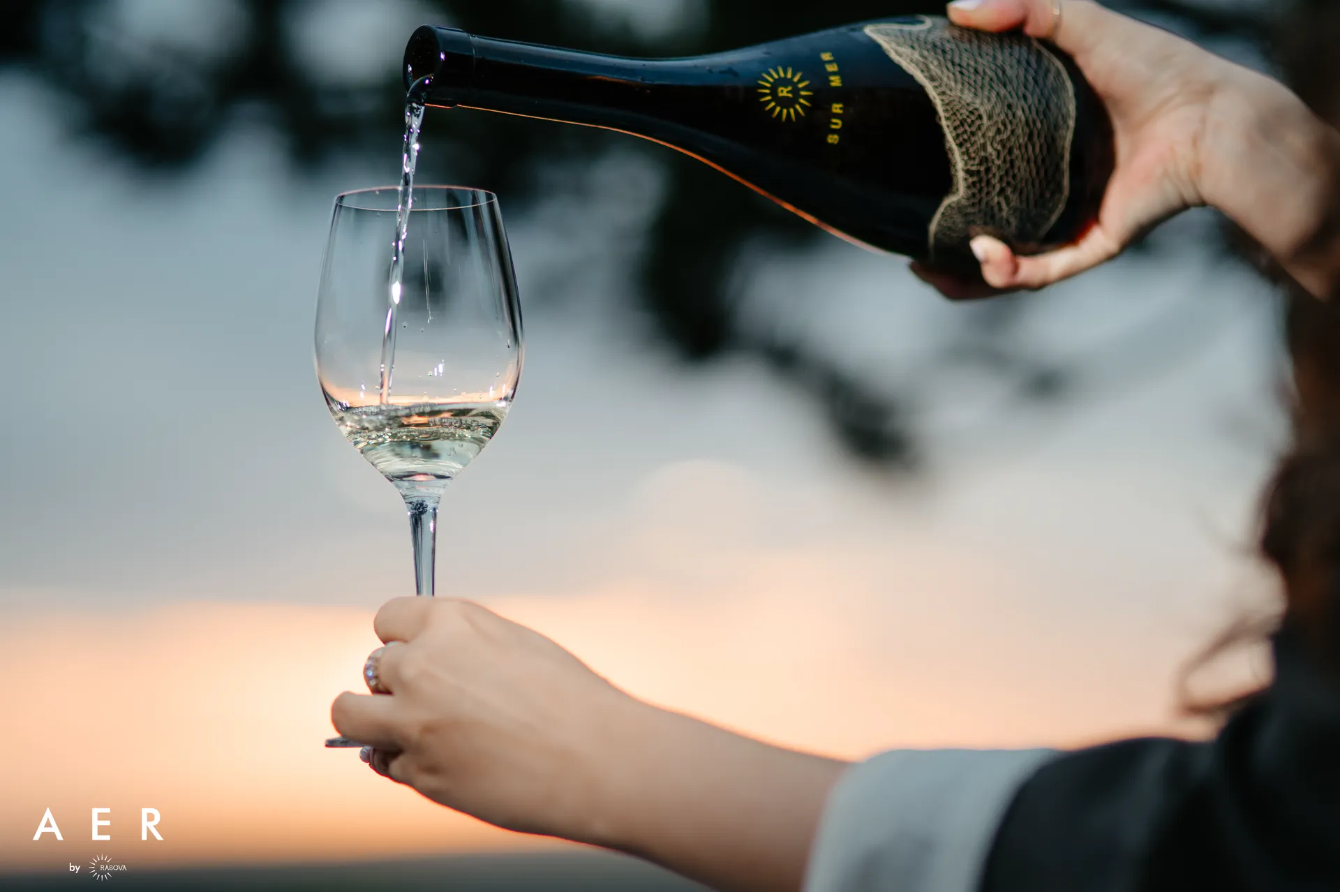 Wine poured at dusk, at AER